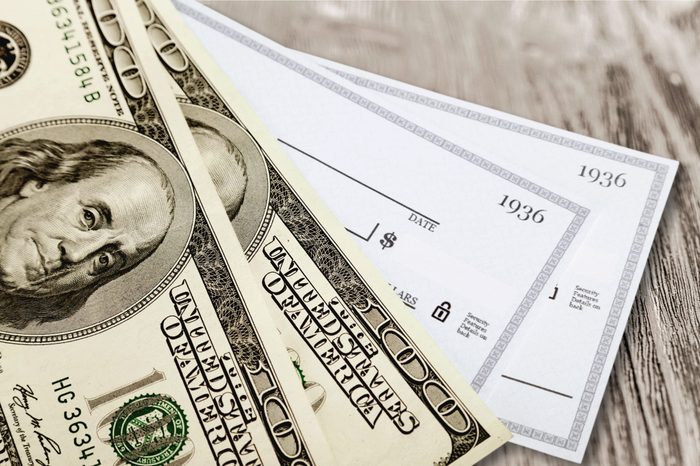 American dollar bill with check