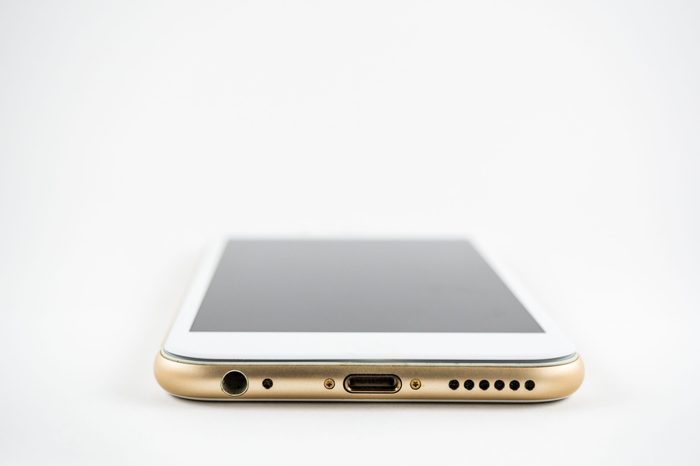 Speaker, lighting connector, bottom microphone of smart phone isolated on white