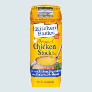 Carton holds chicken stock, displaying ladle illustration, text detailing ingredients and features like low sodium. Bright yellow packaging highlights 