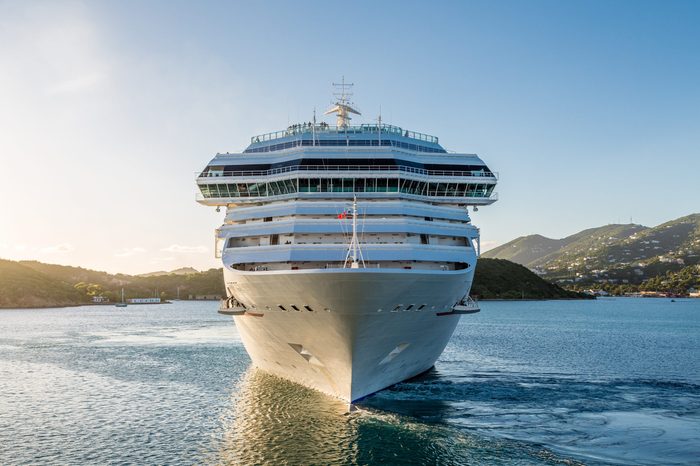 White Luxury cruise ship in bay from front