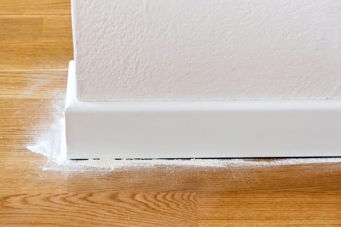 Insect powder between parquet and wooden baseboards