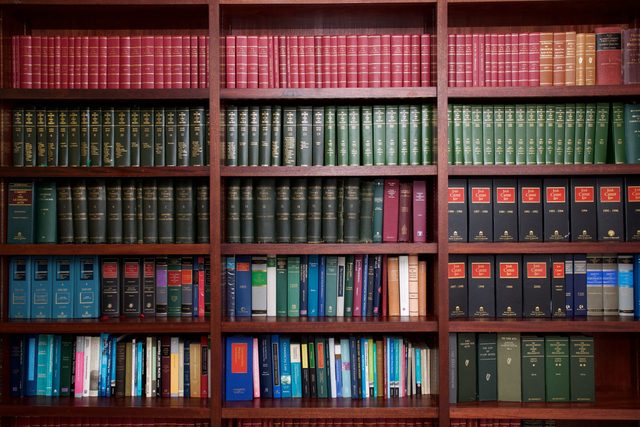 A bookshelf containing volumes of books