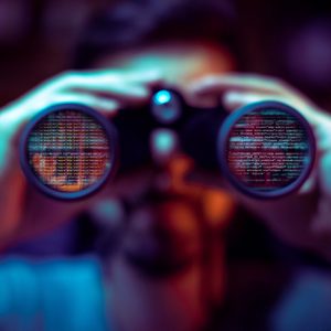 Binoculars display digital code; a person observes in a dimly lit environment, focusing on screens with reflected text.