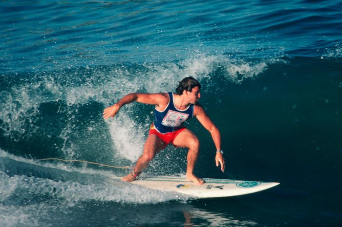 HUNTINGTON BEACH, CA - 1983: A surfer competes in the 1983 Huntington Beach, California, United States Surfing Championships