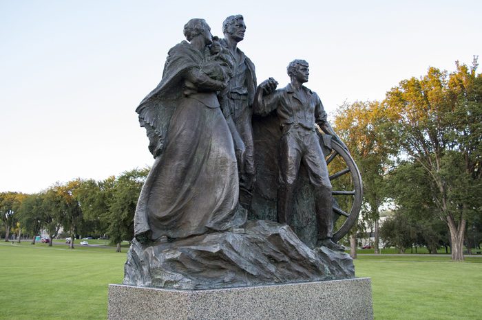BISMARCK, NORTH DAKOTA - August, 27, 2016: Statue of the Pioneer Family, located on the North Dakota Capital Grounds.