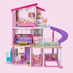 Dollhouse features rooms with furniture and decor in vibrant colors, including a slide and balcony, within a pink-themed multi-level structure.