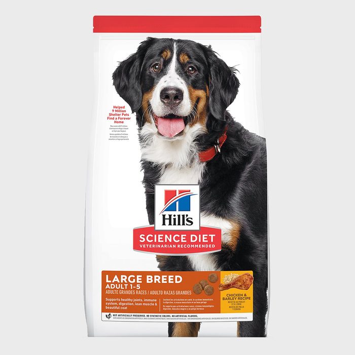Dog food packaging shows a happy dog, promotes Hillâ€™s Science Diet for large breed adults, emphasizing health benefits and chicken barley recipe.