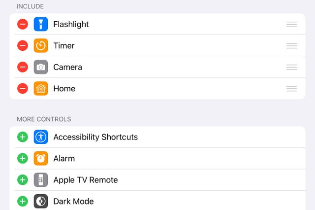 Control center customization screen showing included shortcuts: Flashlight, Timer, Camera, Home. More controls available: Accessibility Shortcuts, Alarm, Apple TV Remote, Dark Mode.