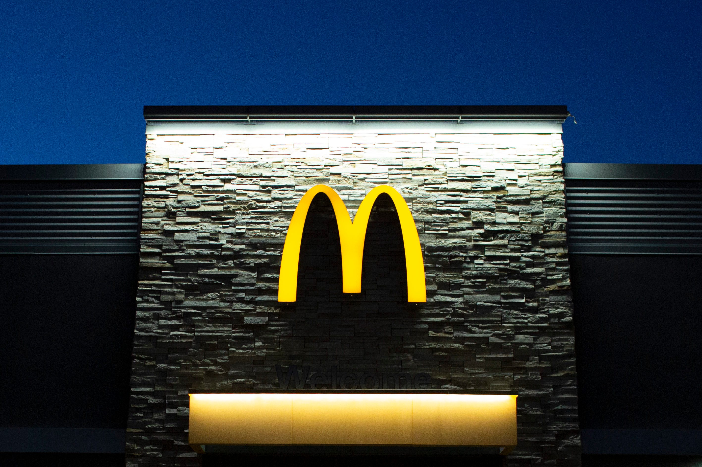 mcdonalds sign on the building at dusk