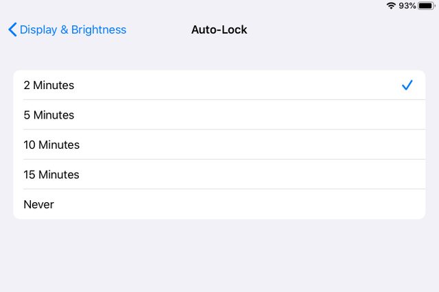 Options are displayed for auto-lock timing on a device screen; "2 Minutes" is selected. The context is the "Display & Brightness" settings.
