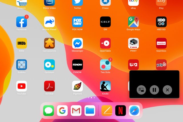 Apps displayed on a digital device's colorful homescreen; overlay with three control icons: minimize, pause, and close.