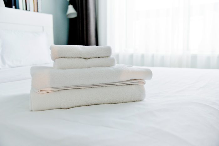 Clean towels on hotel bed