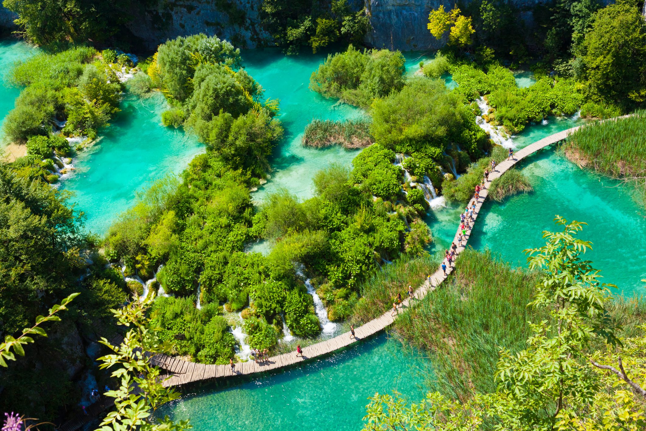 Tourists go on special tracks around the lake