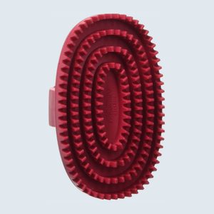 Red rubber curry comb with textured serrated layers, intended for grooming animals, positioned against a plain light blue background.