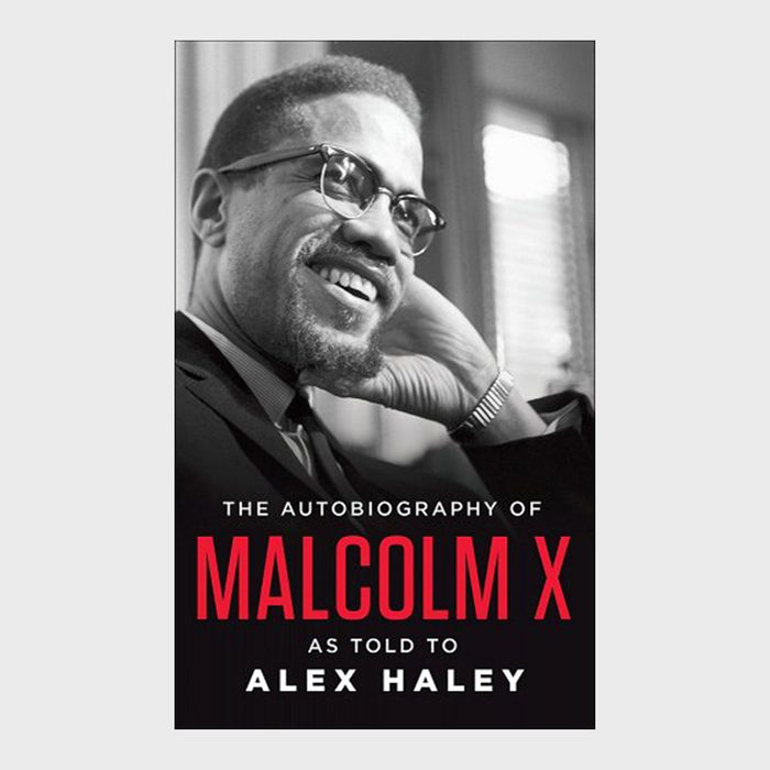 A man smiles, resting his head on his hand. Book cover text: 