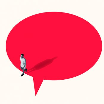 Person walking on large red speech bubble; shadow cast on a white background.