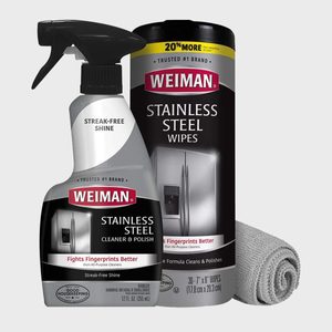 Cleaner spray bottle and wipes container stand beside a rolled cloth, promoting stainless steel polishing in a neutral setting.