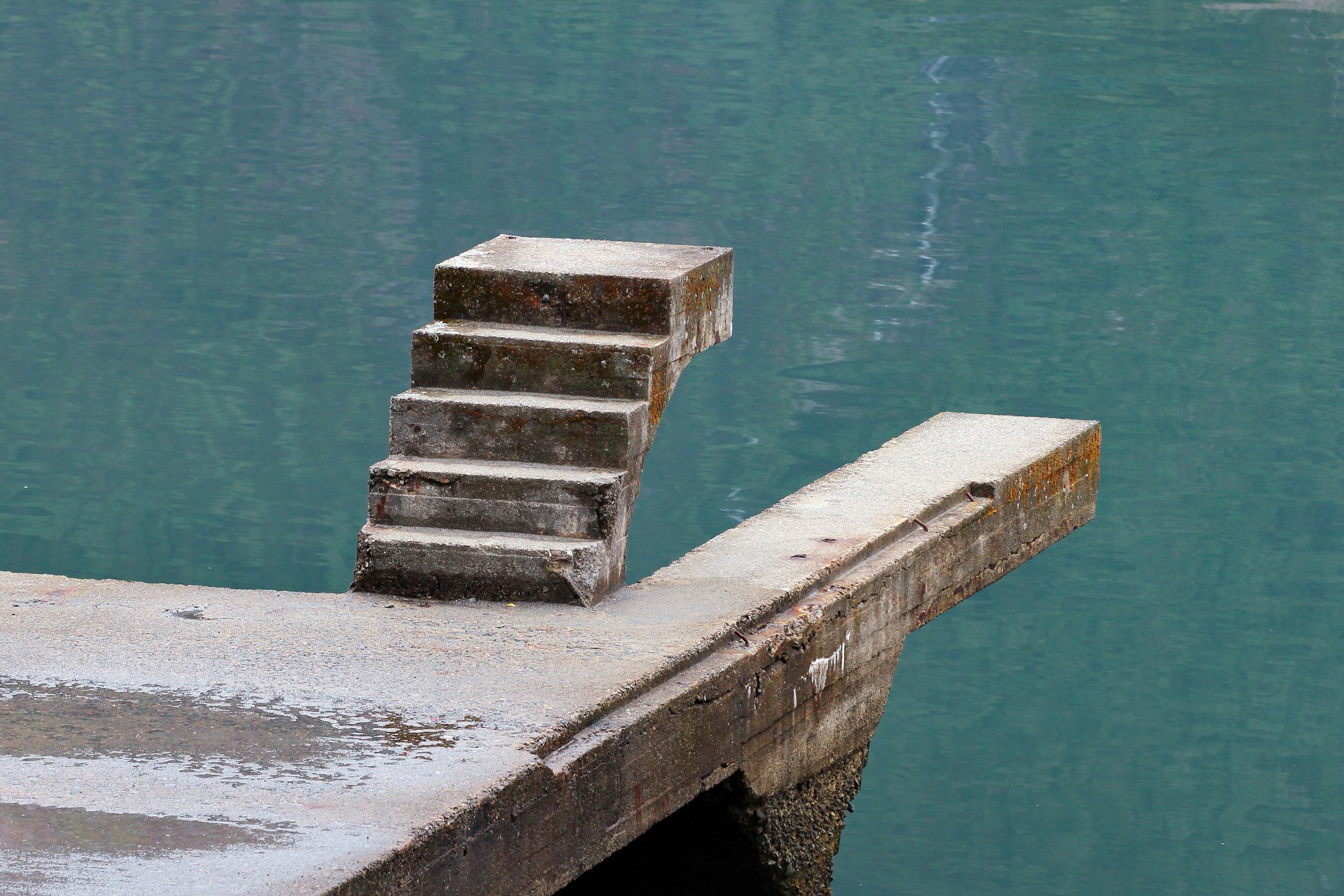 Unfinished staicase over the water