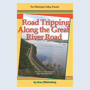Book cover shows a winding road beside a large river, bordered by trees. Text: 