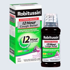 Cough syrup bottle alongside box displaying 