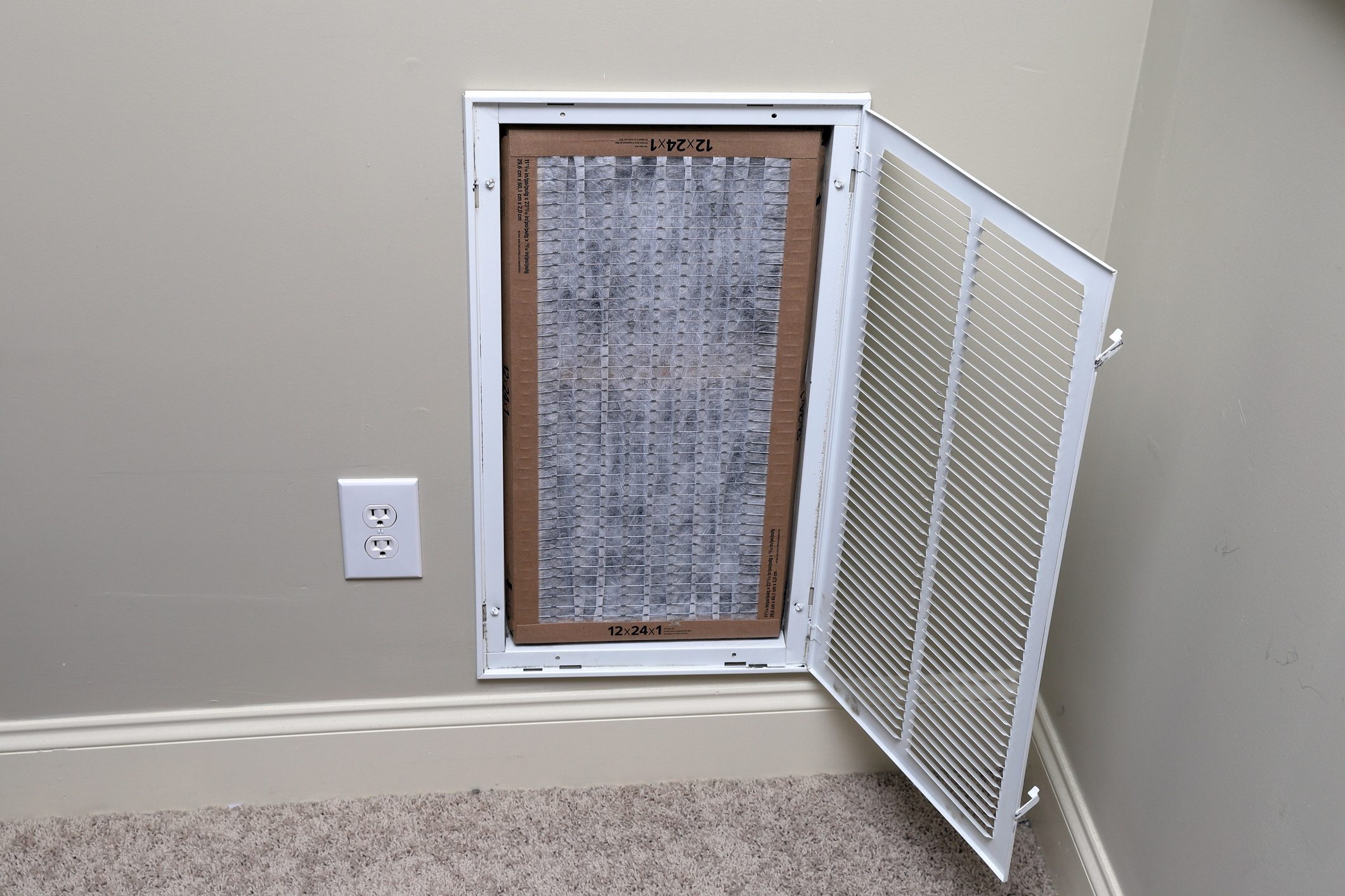 replacing clean air filter for air conditioner maintenance