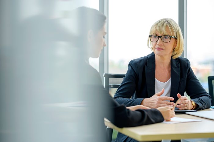 Serious female financial advisor and client talking and discussing financial plan or investment plan.