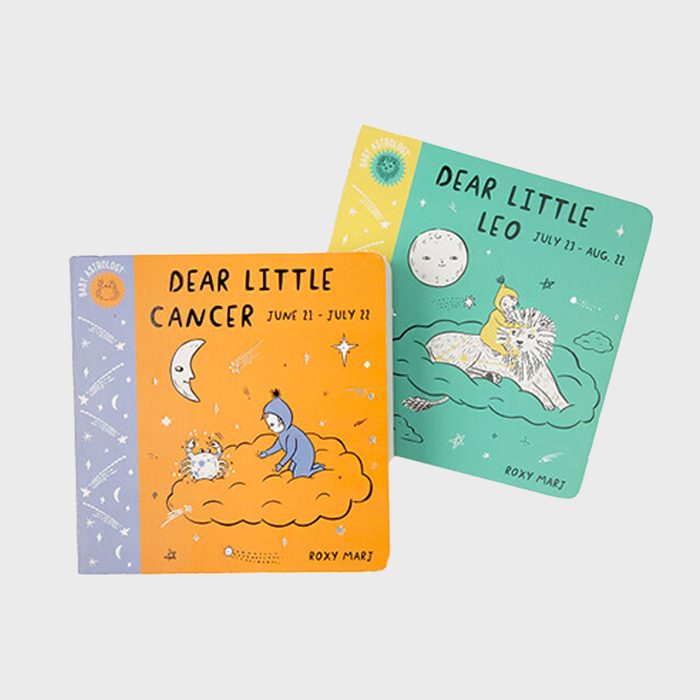 Two illustrated children's books display zodiac themes: one orange with a crab, one green with a lion, against a light background.
