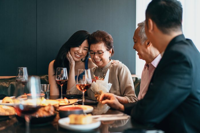 Asian family dining and celebrating Mother's day or birthday