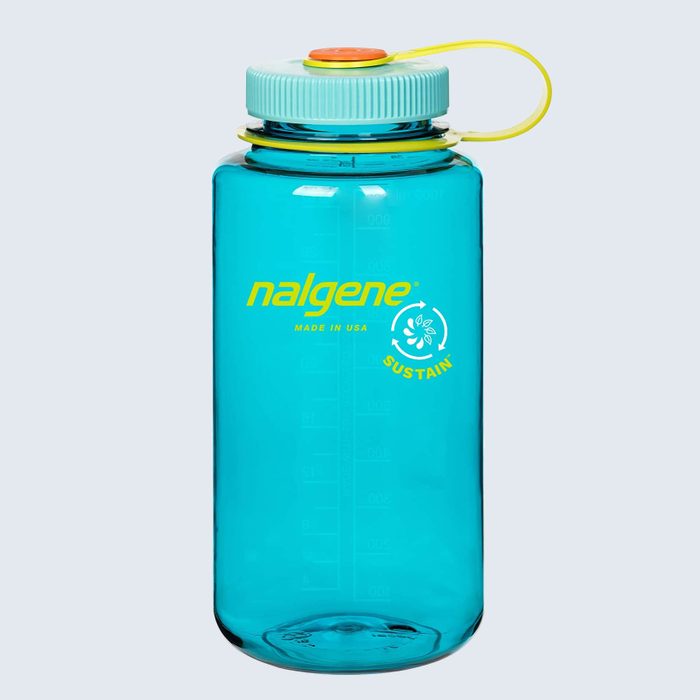 A teal water bottle stands upright, displaying the logo 