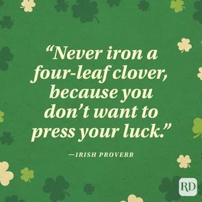 Text quotes an Irish proverb about not ironing four-leaf clovers, amidst scattered clover illustrations on a green background.