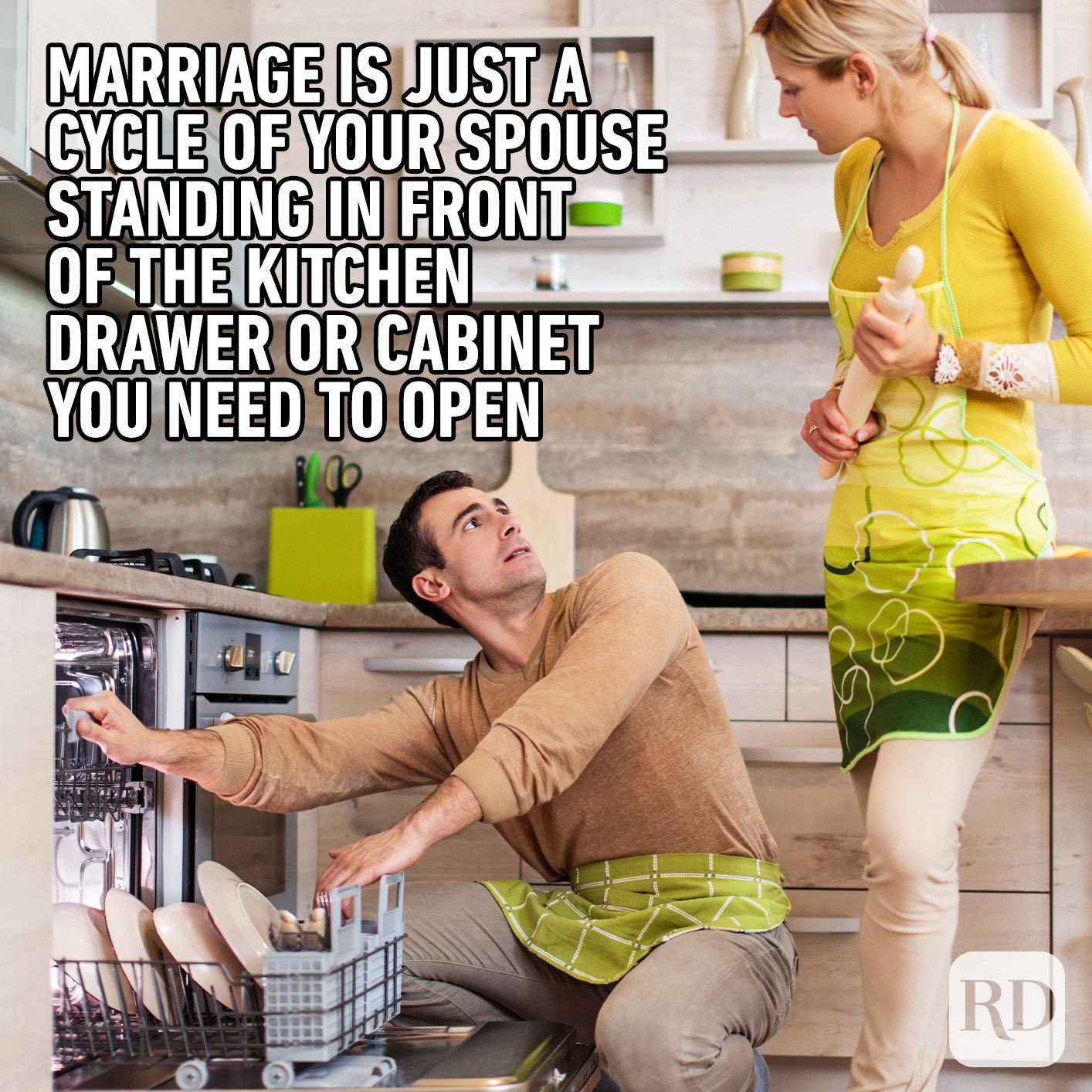 Woman waiting for man to step away from dishwasher. Meme text: Marriage is just a cycle of your spouse standing in front of the kitchen drawer or cabinet you need to open