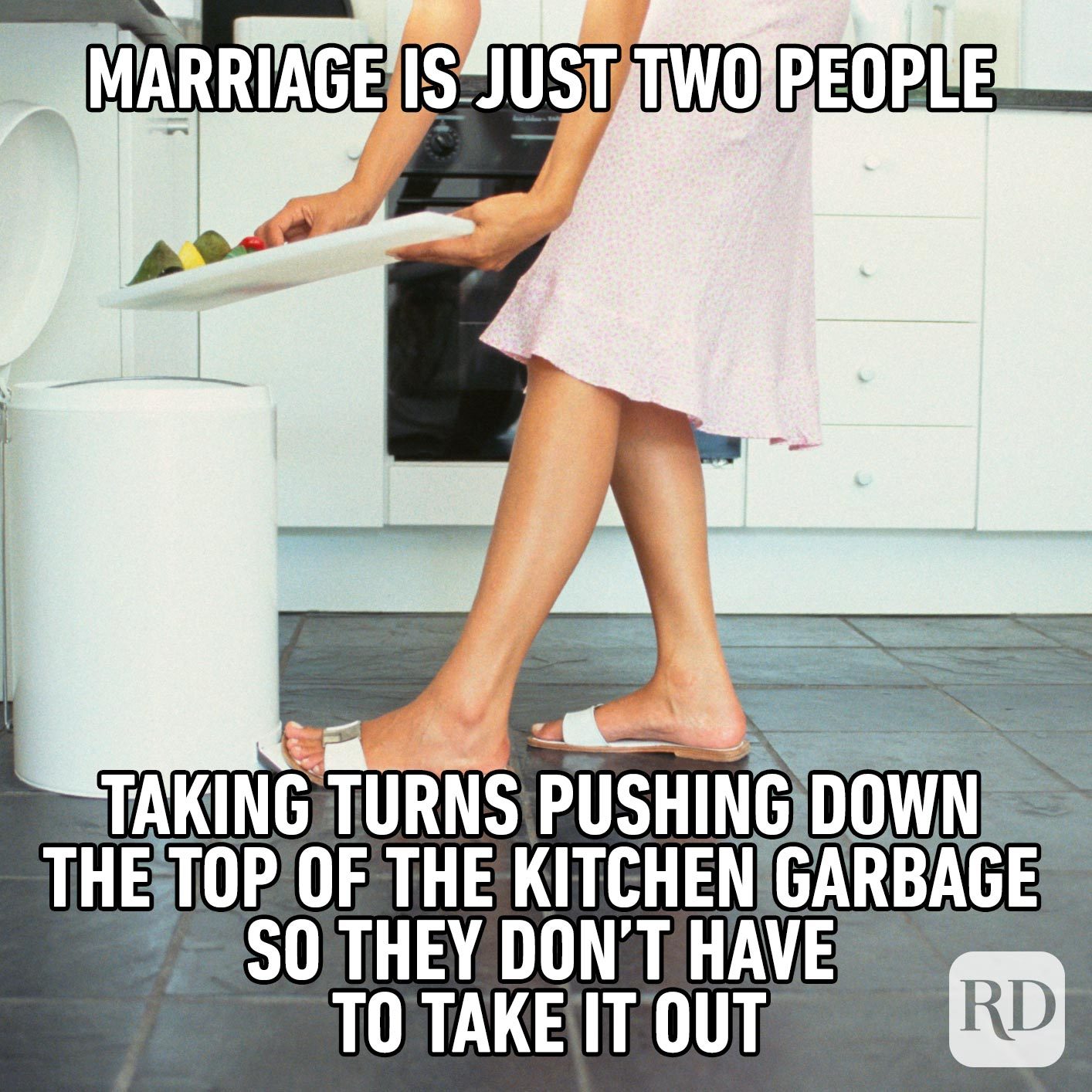 Woman pushing vegetables into the trash. Meme text: Marriage is just two people taking turns pushing down the top of the kitchen garbage so they don’t have to take it out