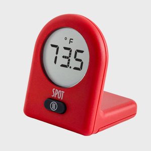 Red digital thermometer displays 73.5Â°F; stands on a flat base with 