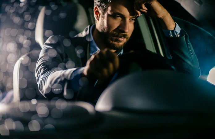 Handsome businessman in car