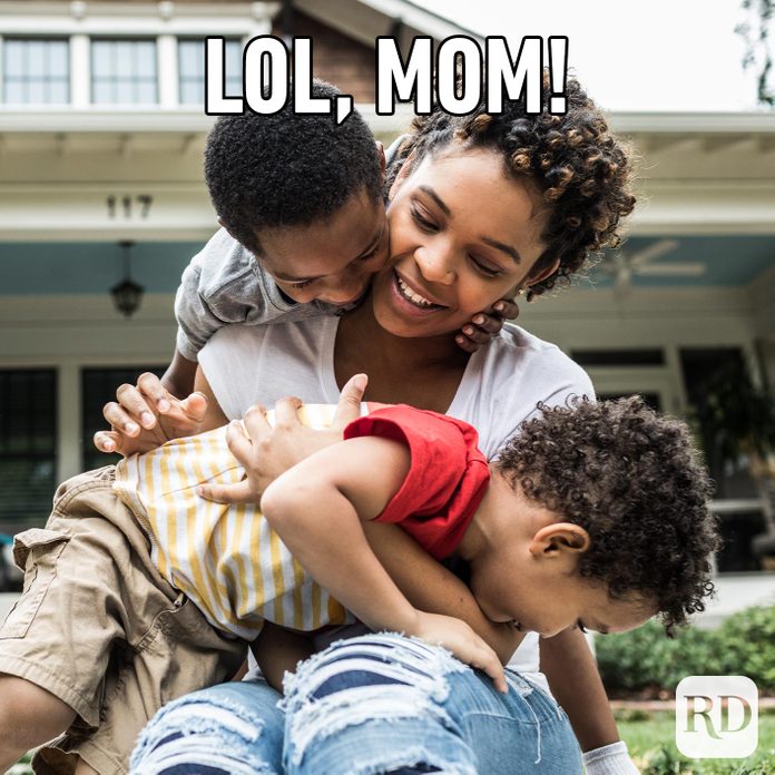 Picture of children squirming into mother's lap
