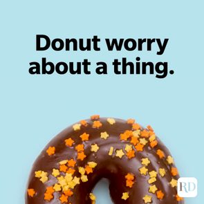 Chocolate donut topped with colorful sprinkles sits against a light blue background. Text above reads, 