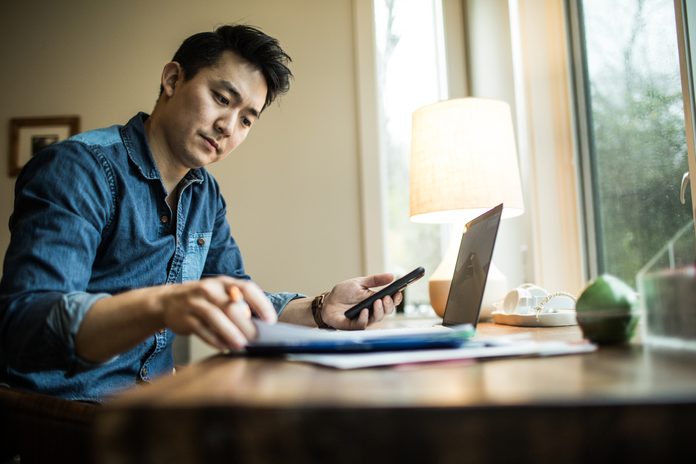 Man working on mobile banking