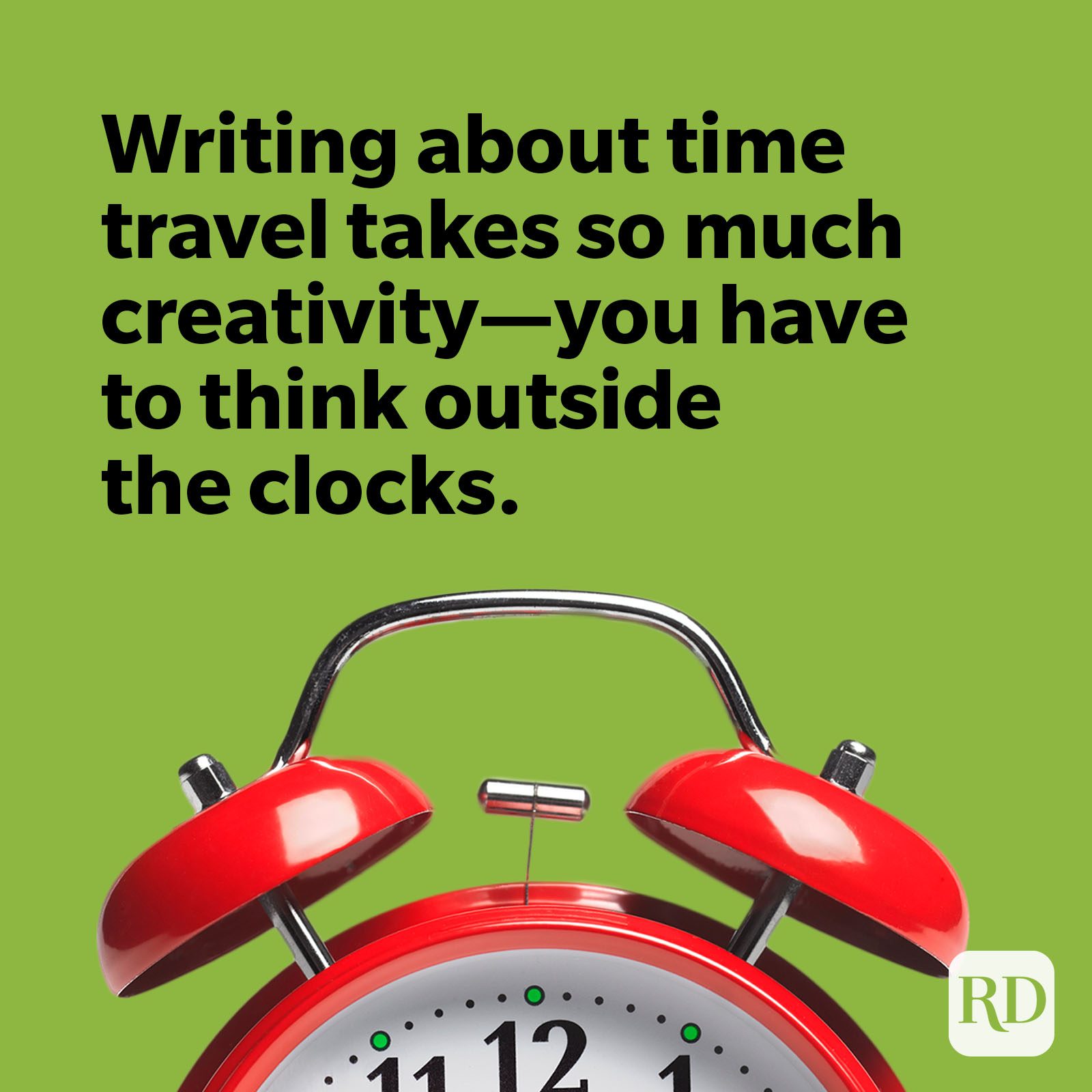Red alarm clock on green background