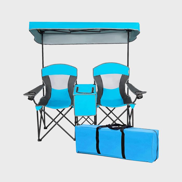 Chairs sit side-by-side with attached canopy; cooler bag in center, blue carrying case below, set against plain background.