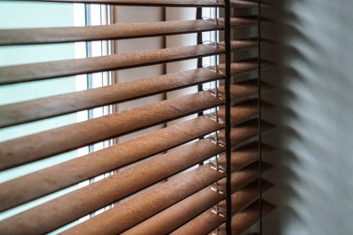 wood blind shade curtain and shadow