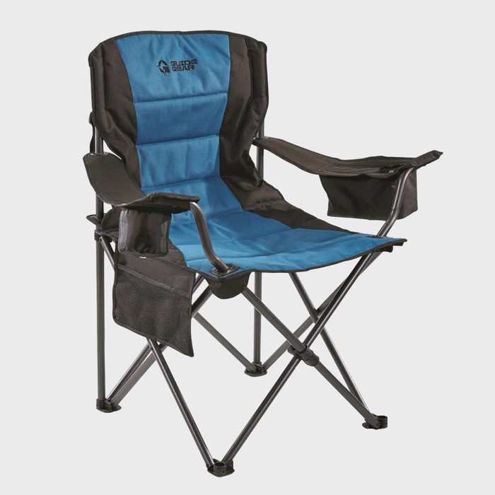 A blue and black foldable camping chair with armrests and cup holders sits upright against a plain background. Text reads 