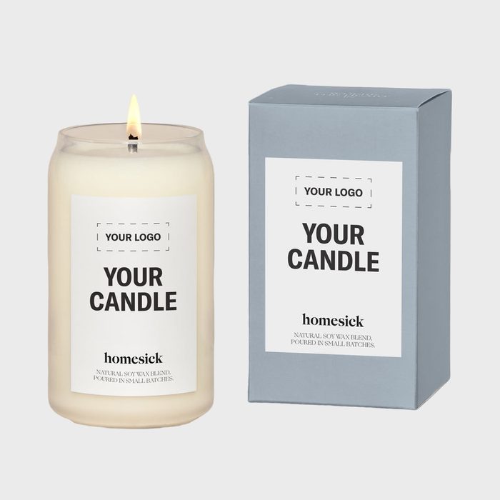 Lit candle sits beside a blue box, labeled 