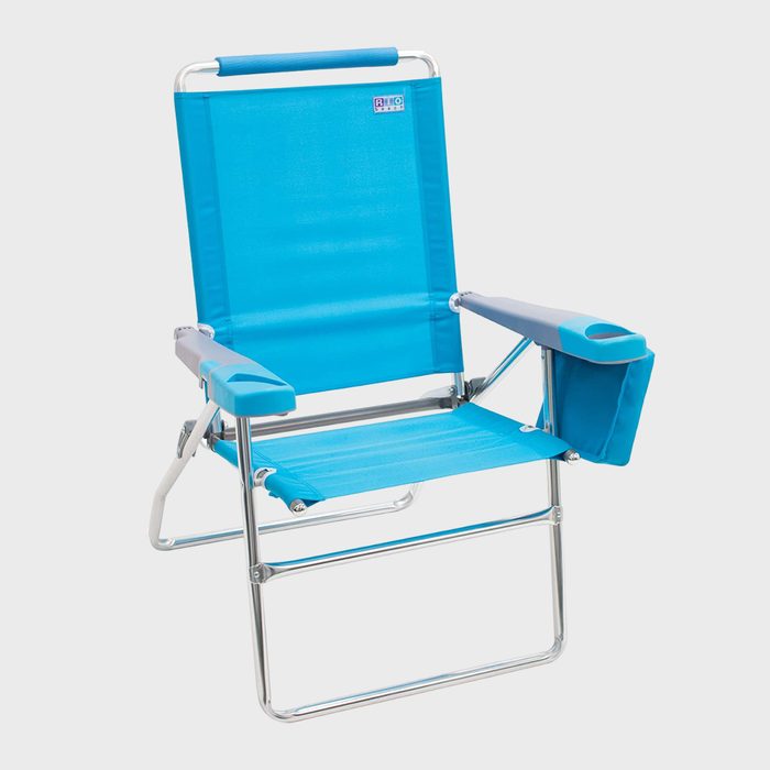 Chair standing alone, featuring bright blue fabric and a metal frame, with cup holder armrests, on a plain white background.