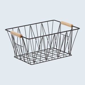A black wire basket with wooden handles sits empty against a plain light background.