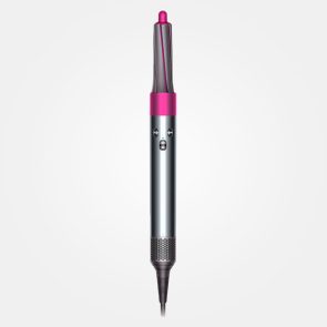 Curling iron standing upright, featuring a metallic body with a pink tip, set against a plain white background.