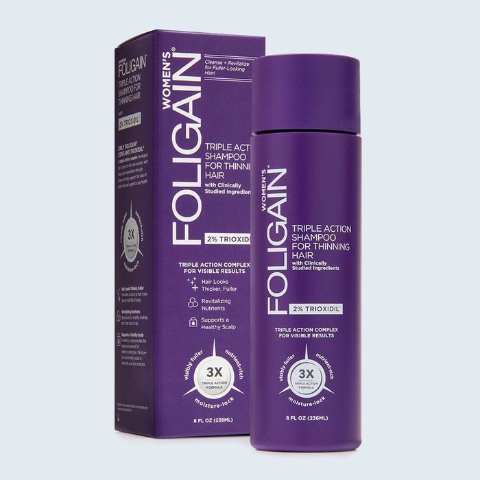 Purple shampoo bottle stands beside matching box; labeled 