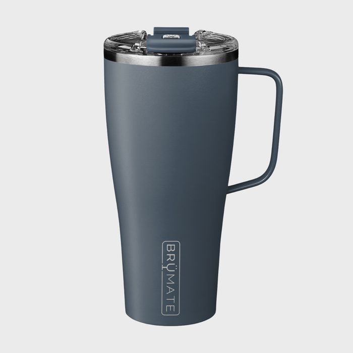 Gray insulated mug stands upright on a plain background, featuring a handle and a transparent lid. Text on the mug reads 