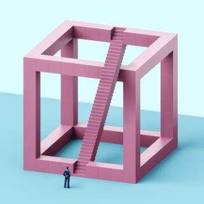 A person observes a large, pink, open cube structure with staircases, set in a minimalist blue environment.