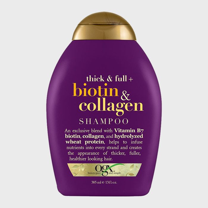 A purple shampoo bottle emphasizes biotin and collagen, promising thicker, fuller hair. Gold cap and product description add elegance. Contains 385 ml (13 fl. oz.).