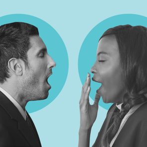 Two people in suits are yawning, facing each other against a blue background.